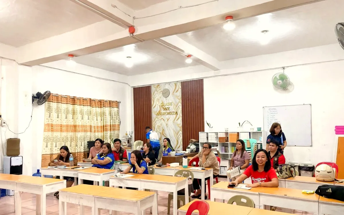 Surigao City Special Science Elementary School teachers seated in a classroom during the Learning Hall presentation
